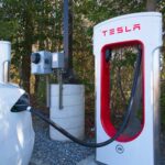When will EV pricing be shown on signage at charging stations?
